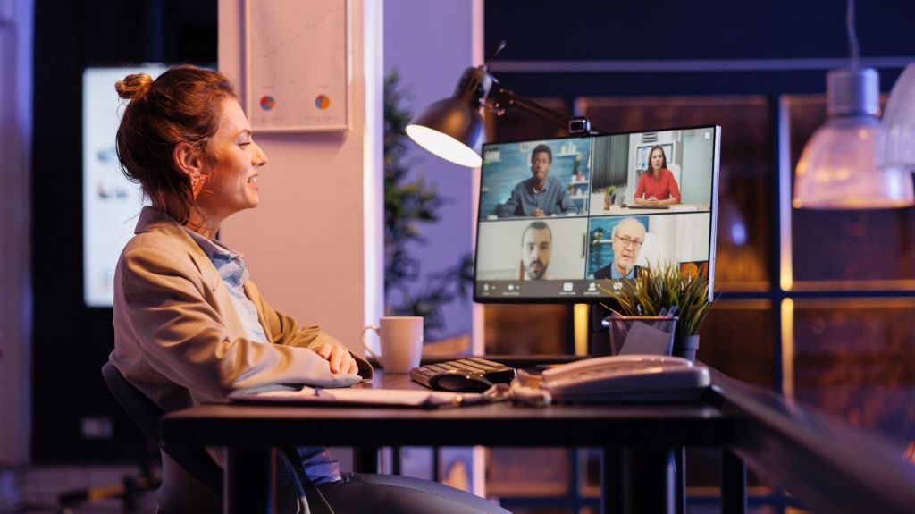 Remote team of engineers collaborating via video calls and project management tools