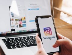 Content creator using Instagram analytics to grow followers organically on mobile phone