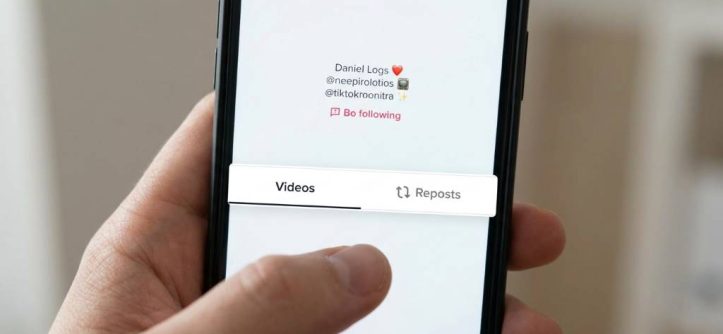 User removing reposted video on TikTok app from smartphone settings