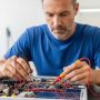 Technician solving real electrical engineering problems with circuit analysis in Texas